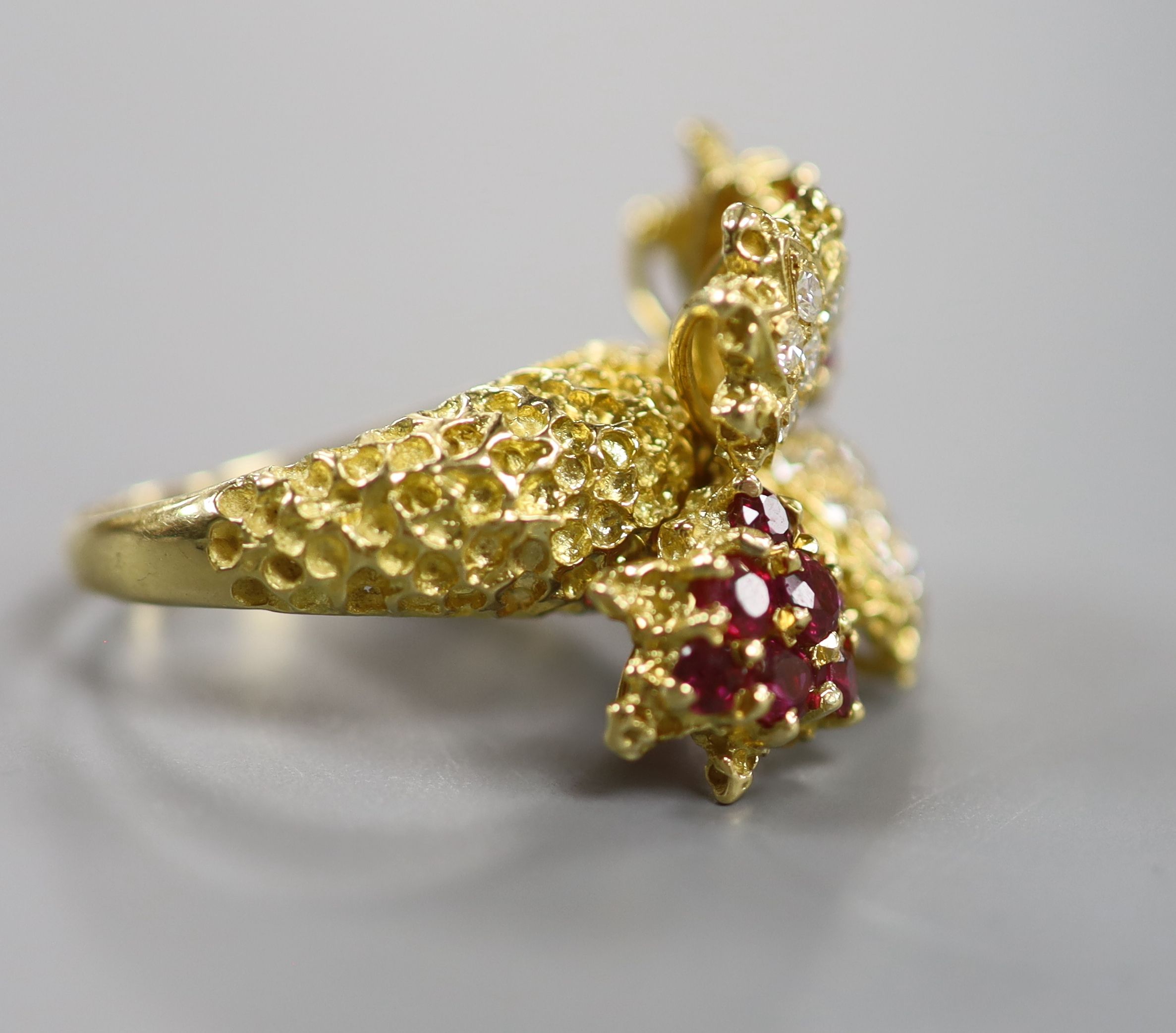 A 1970's 18ct gold, ruby and diamond quadruple cluster dress ring, by Ben Rosenfeld